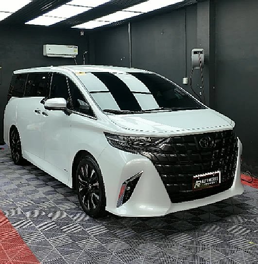 A white Toyota Alphard finished with full body paint protection film, parked in the AR Autoworks Premier bay